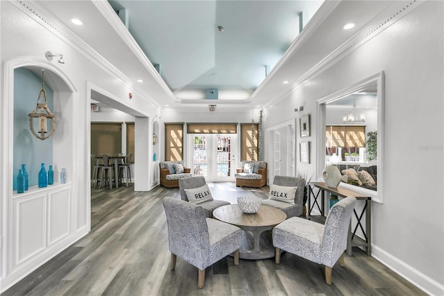 interior space with crown molding, a healthy amount of sunlight, and dark hardwood / wood-style floors