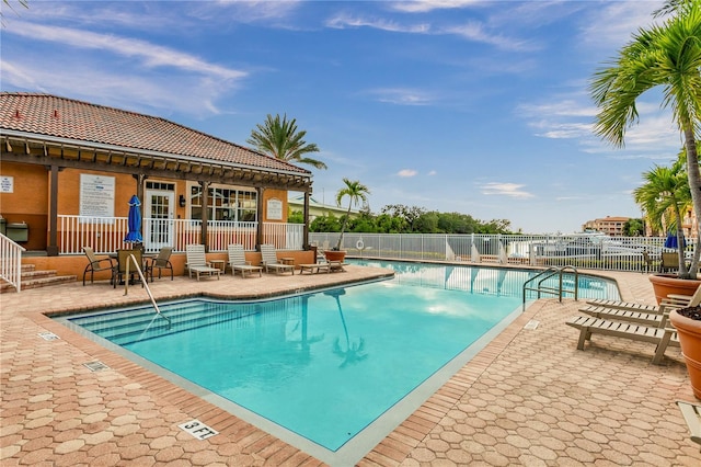 view of swimming pool with a patio