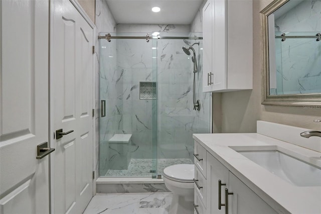 bathroom featuring vanity, toilet, and walk in shower