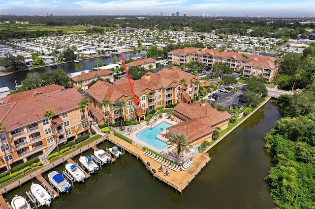 birds eye view of property with a water view