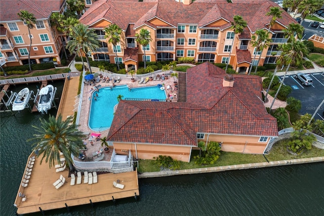 birds eye view of property with a water view