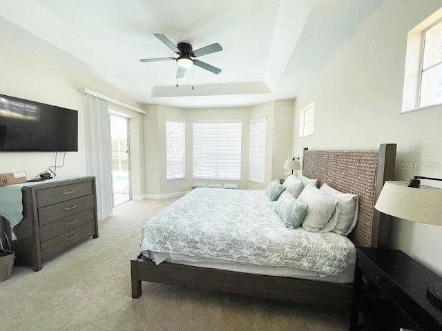 bedroom with ceiling fan, access to exterior, and light carpet