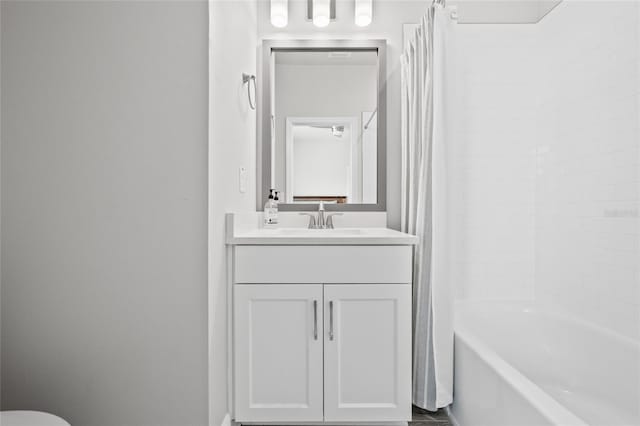 bathroom featuring vanity and shower / bath combo