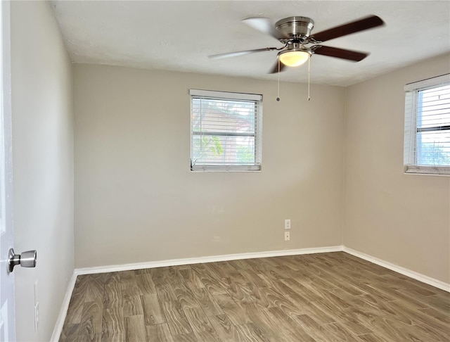 unfurnished room with wood-type flooring and ceiling fan