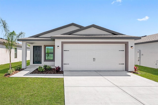 ranch-style house featuring concrete driveway, an attached garage, a front yard, and stucco siding