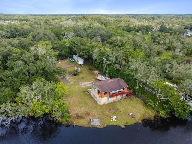 bird's eye view featuring a view of trees and a water view