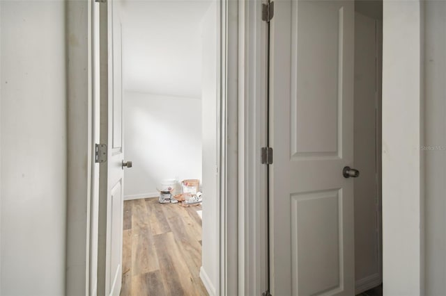 corridor featuring light hardwood / wood-style flooring