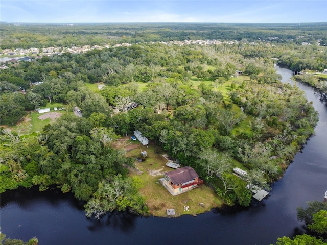 aerial view featuring a forest view and a water view