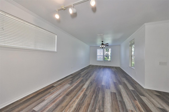 unfurnished room featuring ornamental molding, ceiling fan, and dark hardwood / wood-style floors