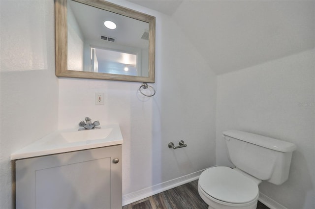 bathroom featuring hardwood / wood-style floors, toilet, and vanity