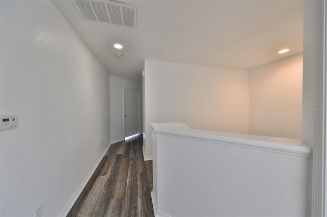 hallway featuring dark wood-type flooring