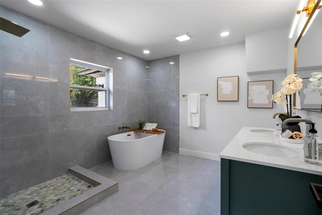 bathroom with vanity, tile walls, and plus walk in shower