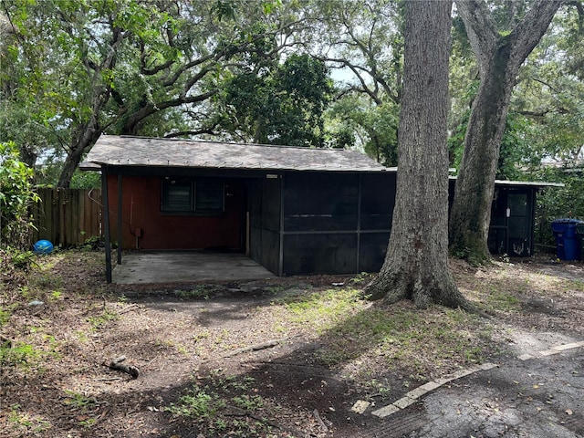 view of outbuilding featuring a carport