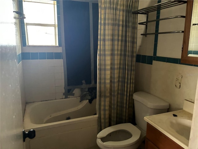 full bathroom with vanity, toilet, and shower / tub combo with curtain