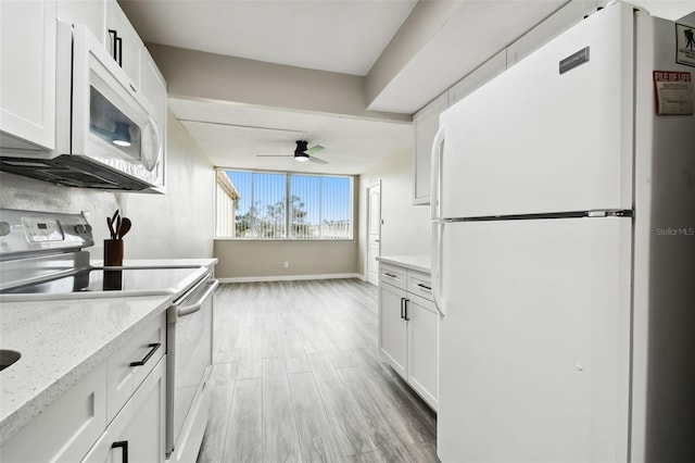 kitchen featuring white cabinets, light wood-type flooring, white appliances, and ceiling fan