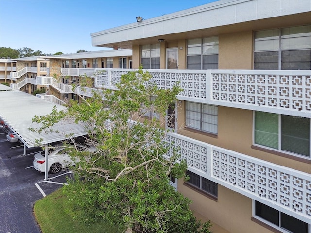 5095 Bay St NE Unit 306, Saint Petersburg, FL 33703 - view of building exterior featuring uncovered parking