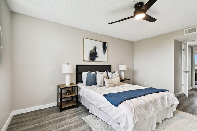 5095 Bay St NE Unit 306, Saint Petersburg, FL 33703 - bedroom with baseboards, a ceiling fan, visible vents, and wood finished floors