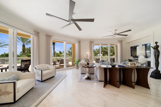 living room with ceiling fan and ornamental molding