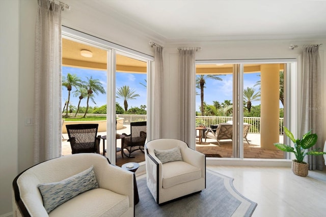 sitting room featuring ornamental molding