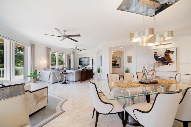 dining room with ceiling fan and ornamental molding