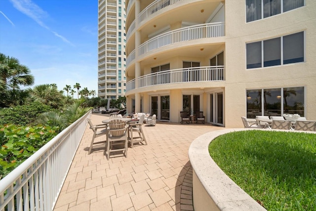 exterior space featuring a balcony and an outdoor hangout area