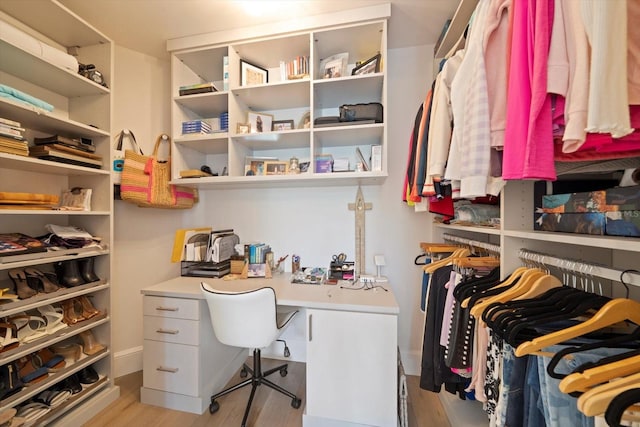 walk in closet featuring light hardwood / wood-style floors