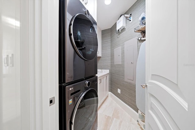 laundry area featuring stacked washer and clothes dryer