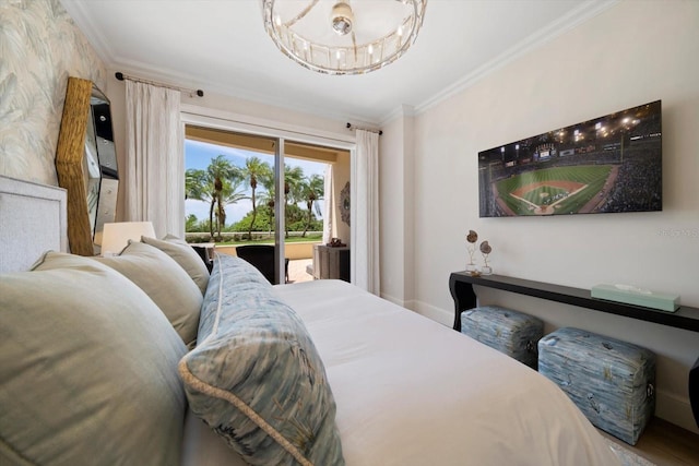 bedroom with ornamental molding, access to exterior, a notable chandelier, and hardwood / wood-style flooring