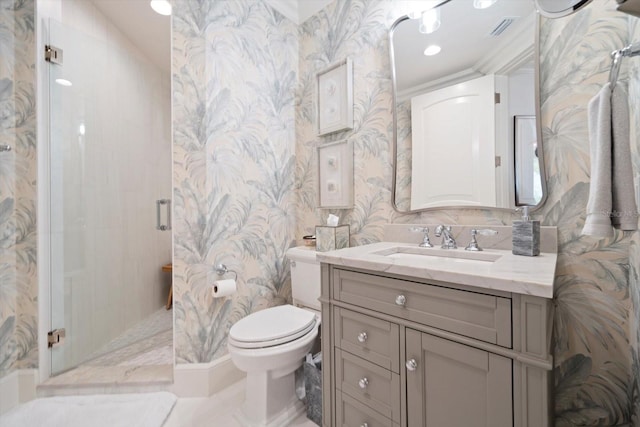 bathroom with vanity, toilet, and a shower with shower door