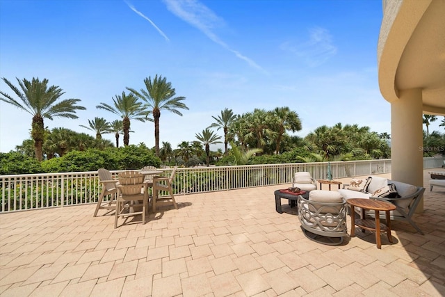 view of patio / terrace featuring an outdoor fire pit