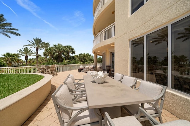 view of patio featuring a balcony