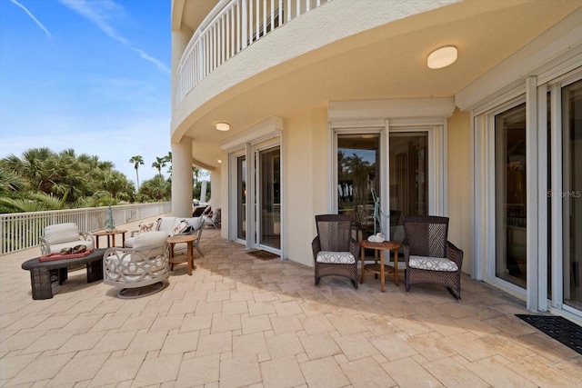 view of patio / terrace with an outdoor hangout area and a balcony