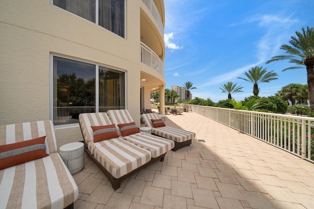 view of patio featuring a balcony