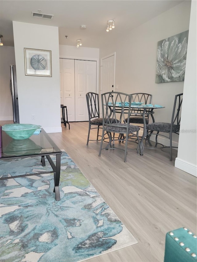 dining room with light hardwood / wood-style floors