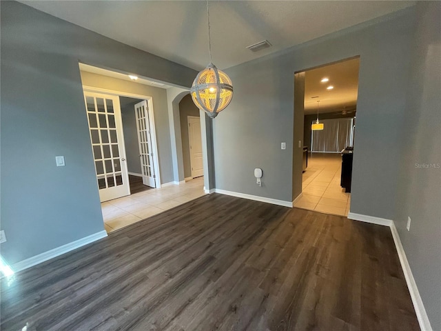 unfurnished dining area with wood-type flooring