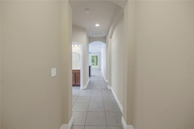 hallway featuring light tile patterned flooring