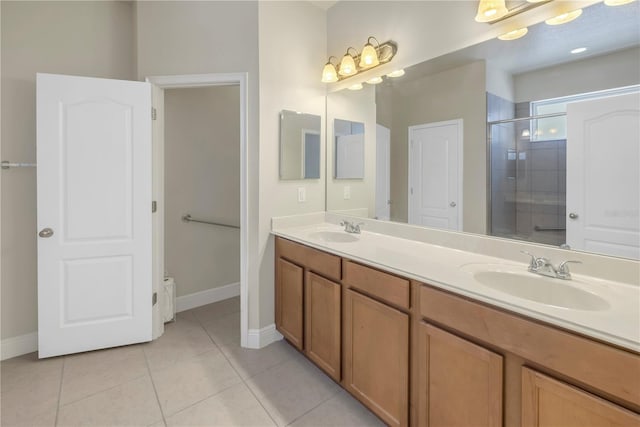 bathroom featuring tile patterned flooring, vanity, and an enclosed shower