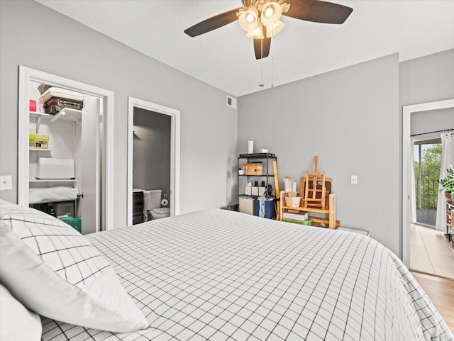 bedroom with light wood-type flooring, ceiling fan, access to exterior, and a textured ceiling