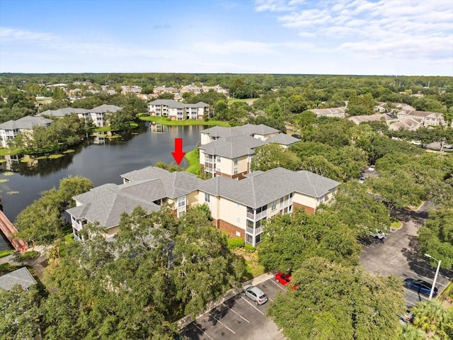 birds eye view of property featuring a water view