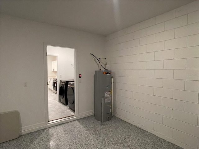 utility room featuring independent washer and dryer and electric water heater