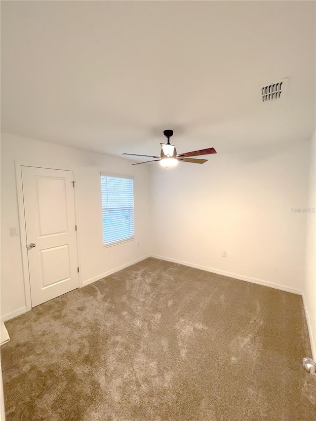 carpeted empty room with ceiling fan