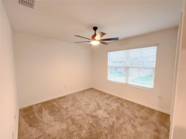 carpeted empty room with ceiling fan