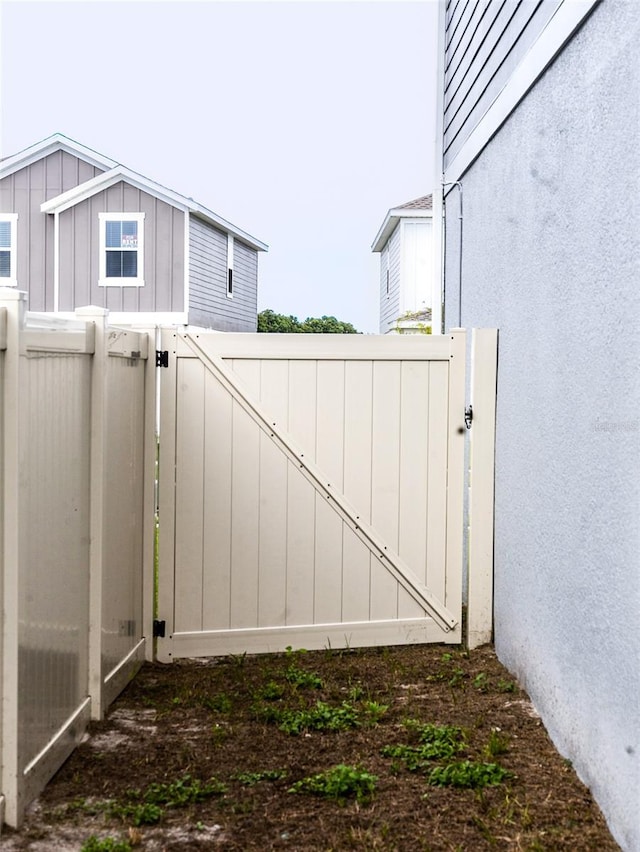 view of gate with fence