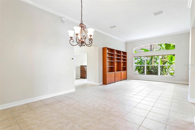 tiled empty room with built in shelves, ornamental molding, and an inviting chandelier