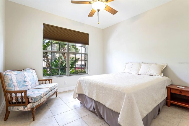 bedroom featuring ceiling fan and light tile patterned flooring