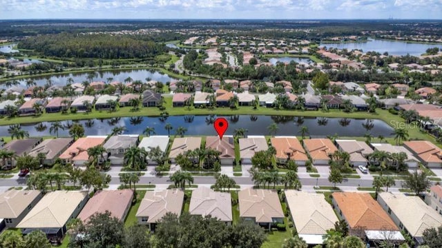 birds eye view of property featuring a water view