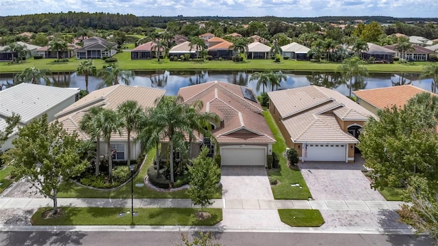 birds eye view of property featuring a water view