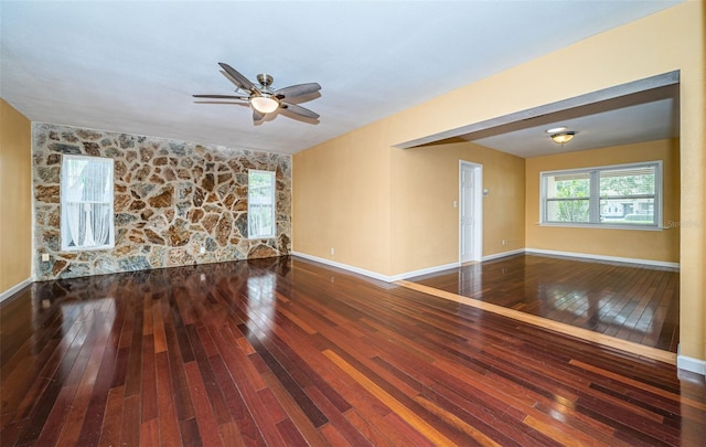 spare room featuring ceiling fan and hardwood / wood-style flooring