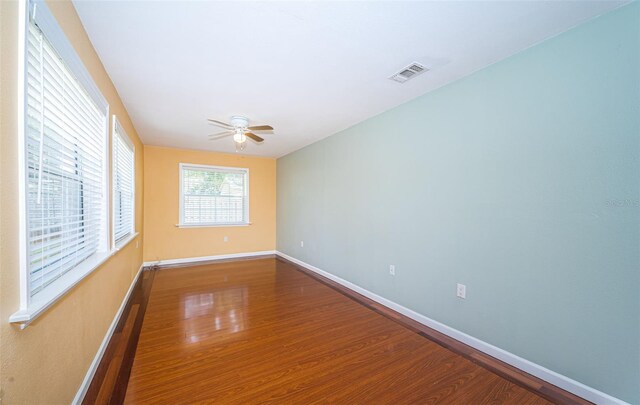 unfurnished room featuring ceiling fan and hardwood / wood-style floors