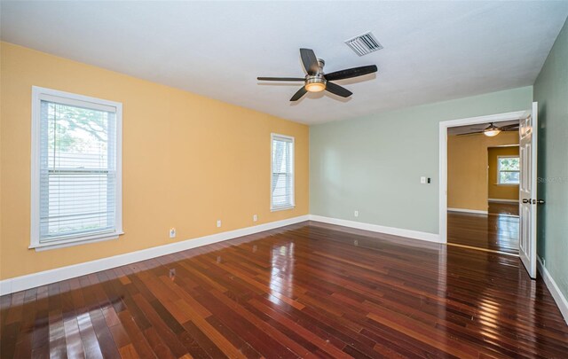 unfurnished room with ceiling fan and dark hardwood / wood-style floors